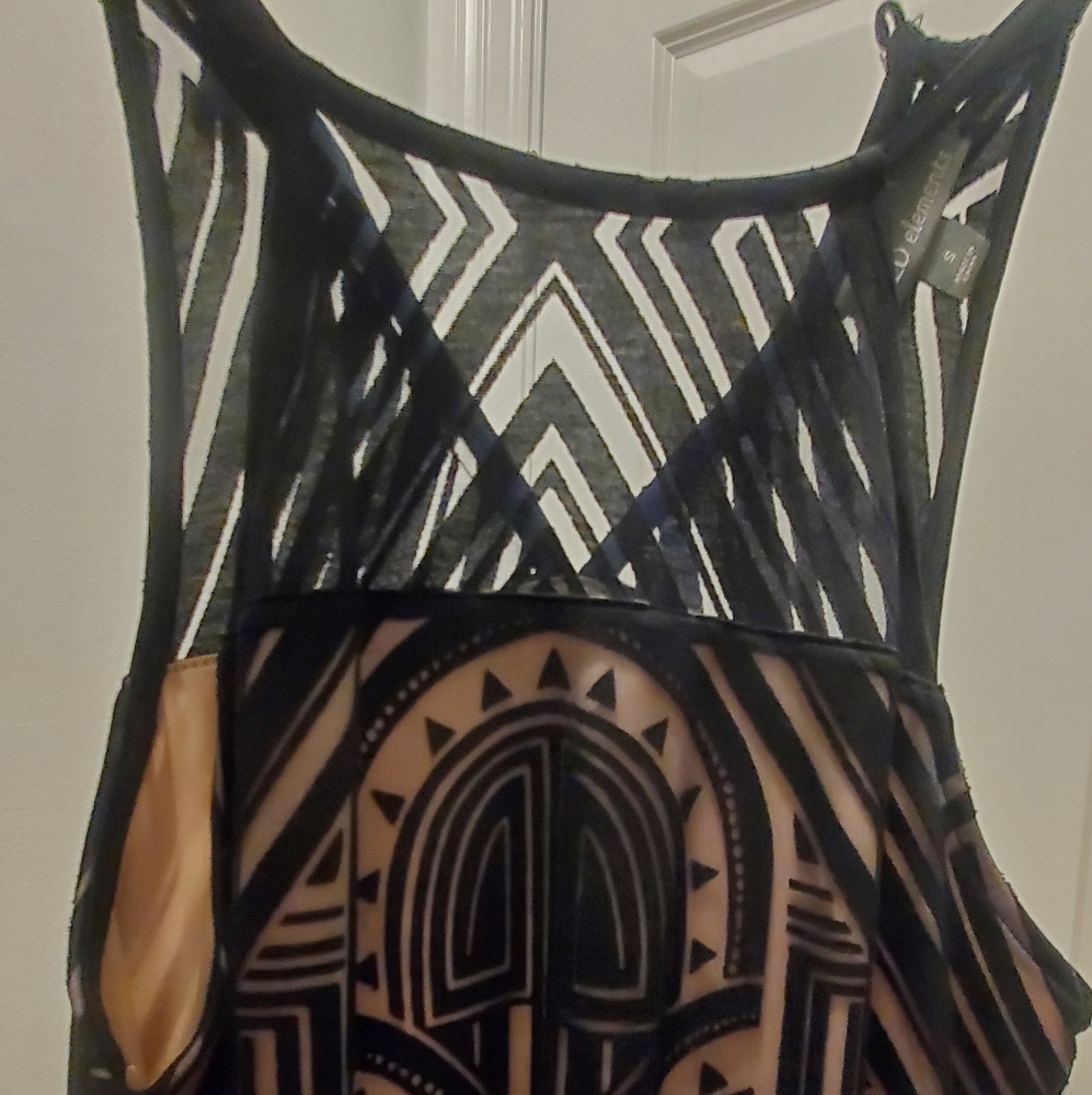 Curve hugging little black sleeveless dress